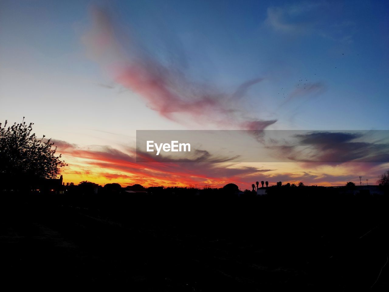 SILHOUETTE LANDSCAPE AGAINST SKY DURING SUNSET