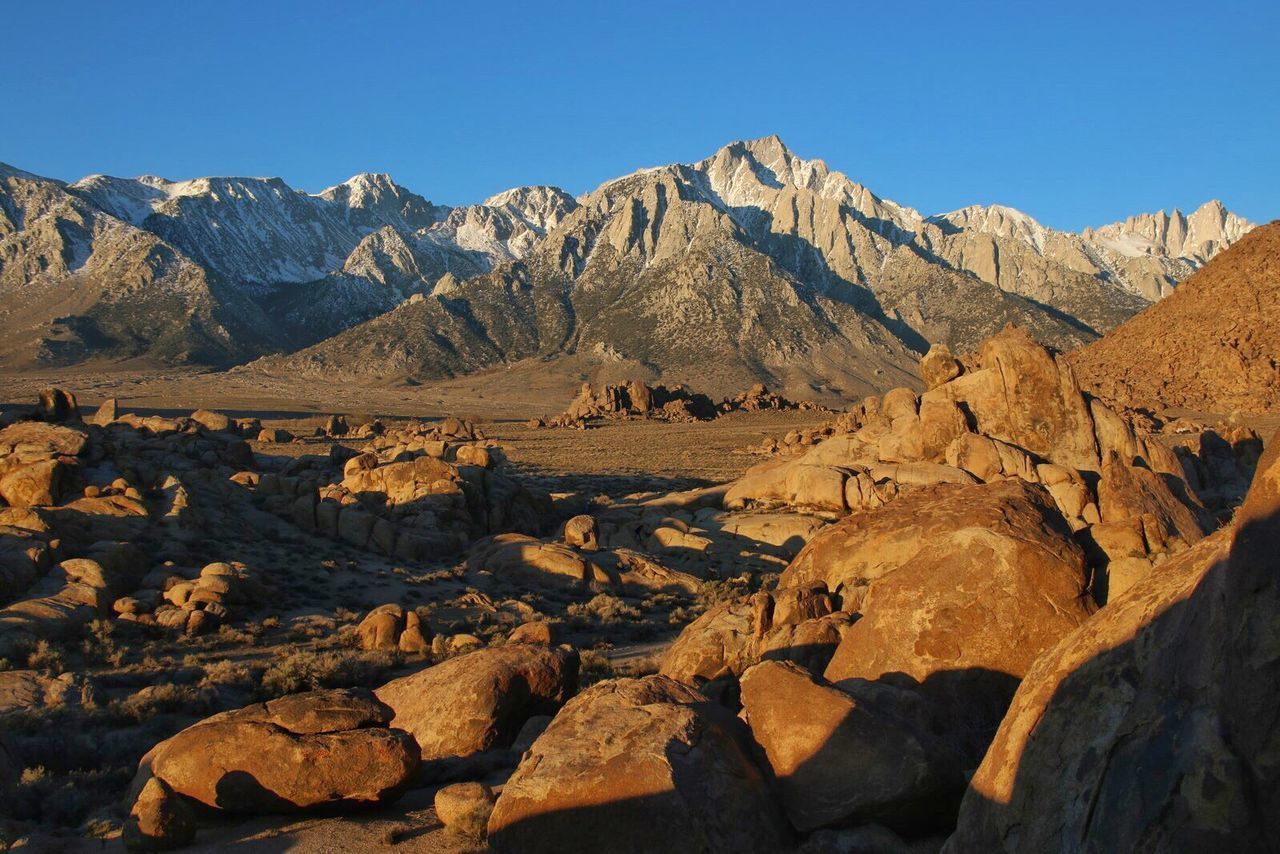 Scenic view of snowcapped mountain against clear sky