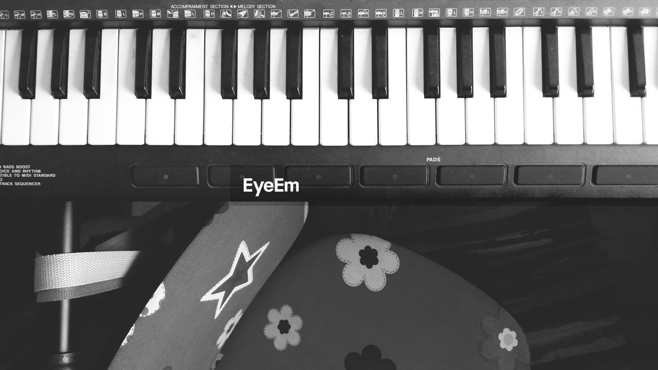 CLOSE-UP OF PIANO KEYS AT HOME