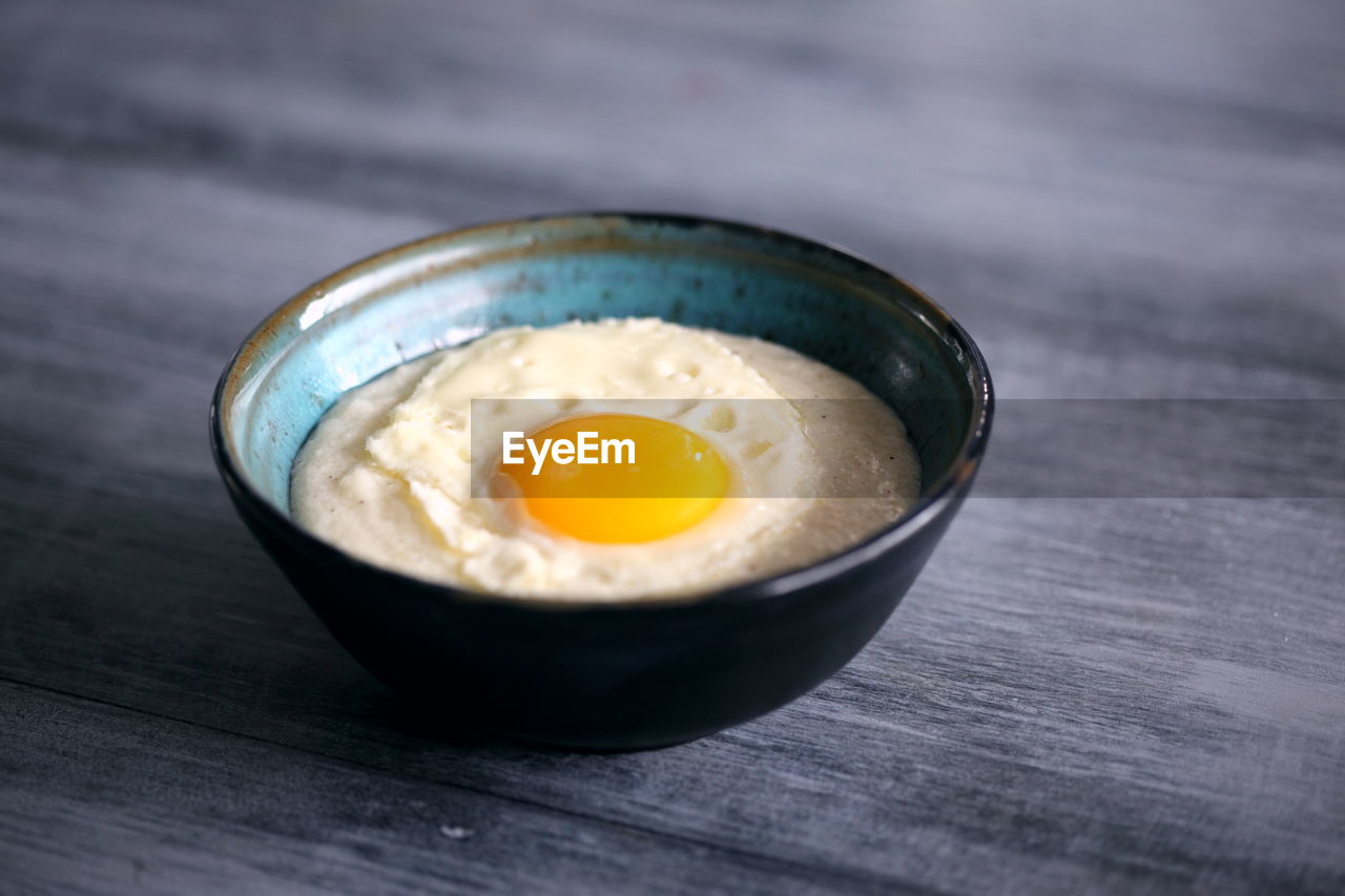Close-up of egg yolk in bowl on table