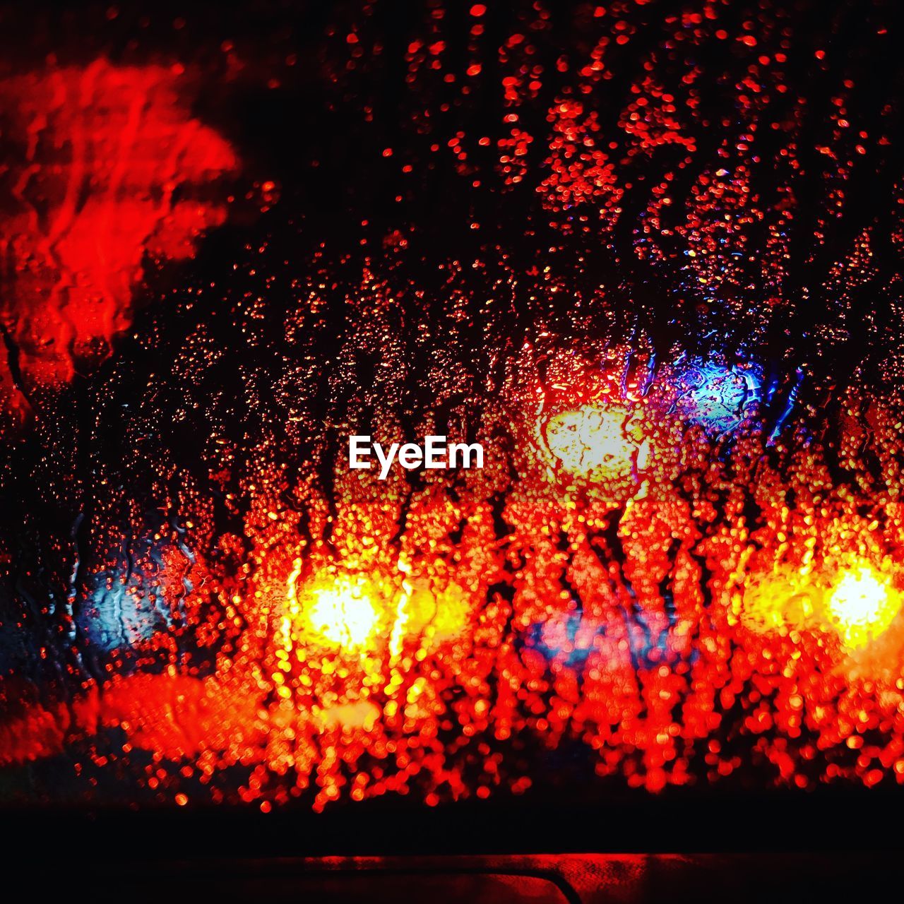 Full frame shot of wet windshield at night