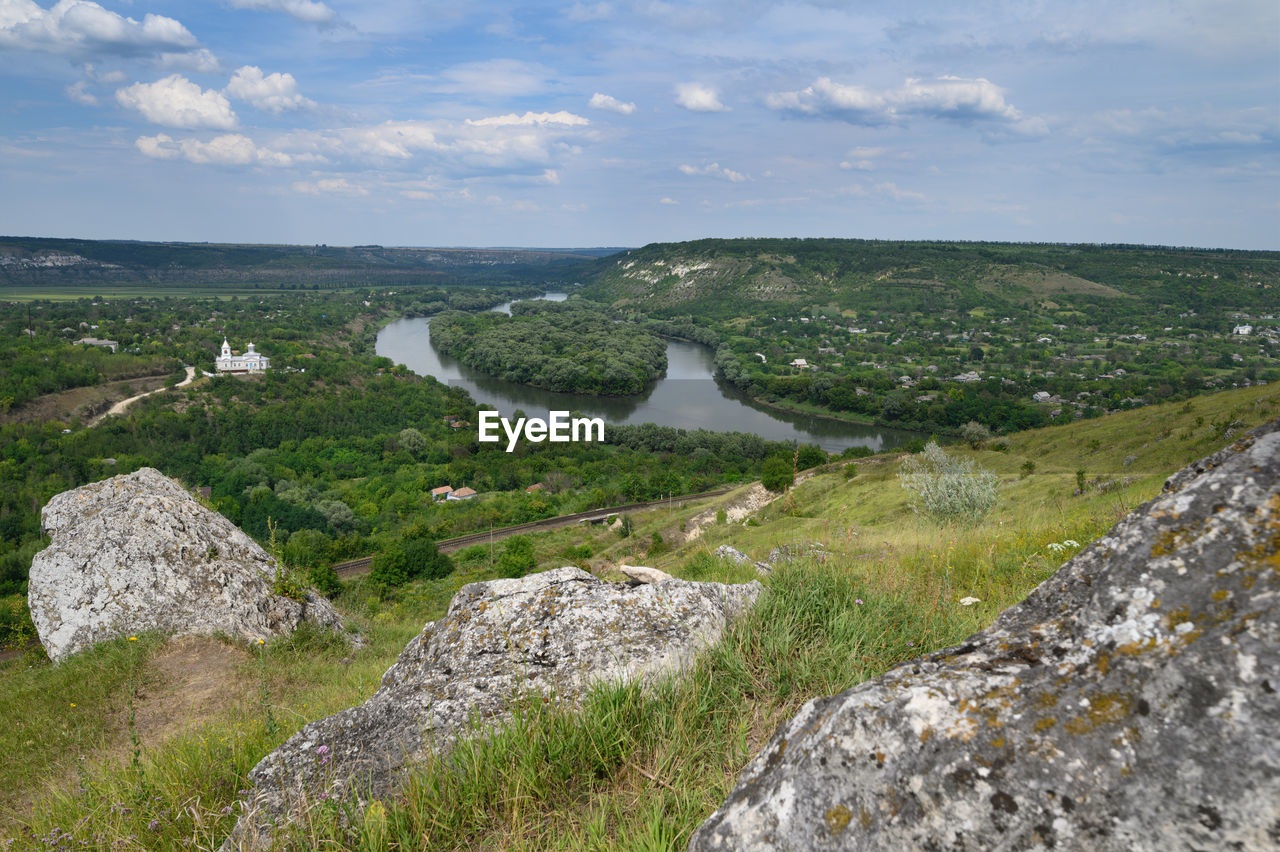 PANORAMIC VIEW OF ROCKS ON LAND AGAINST SKY