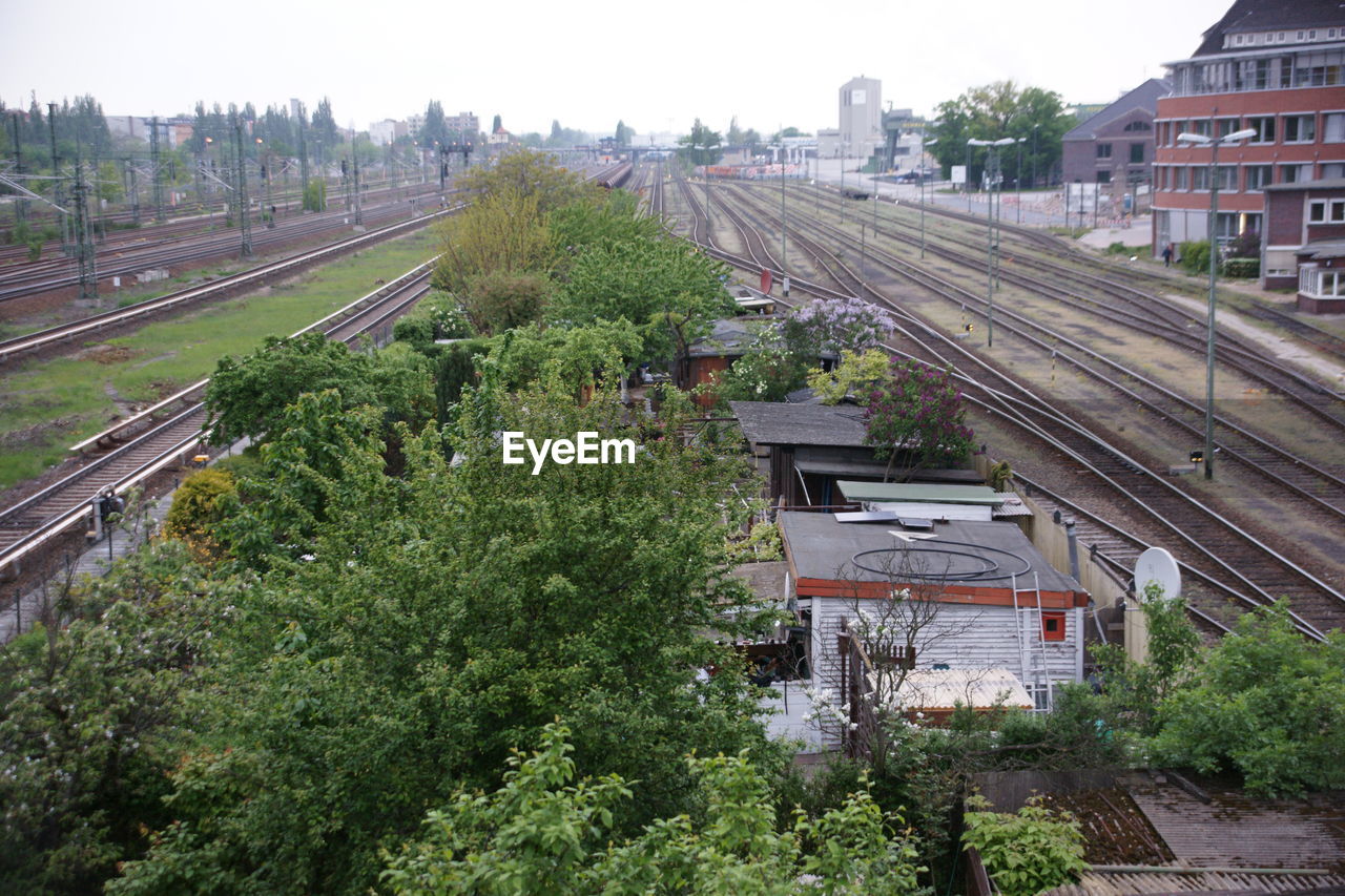 High angle view of trees amidst railroad tracks