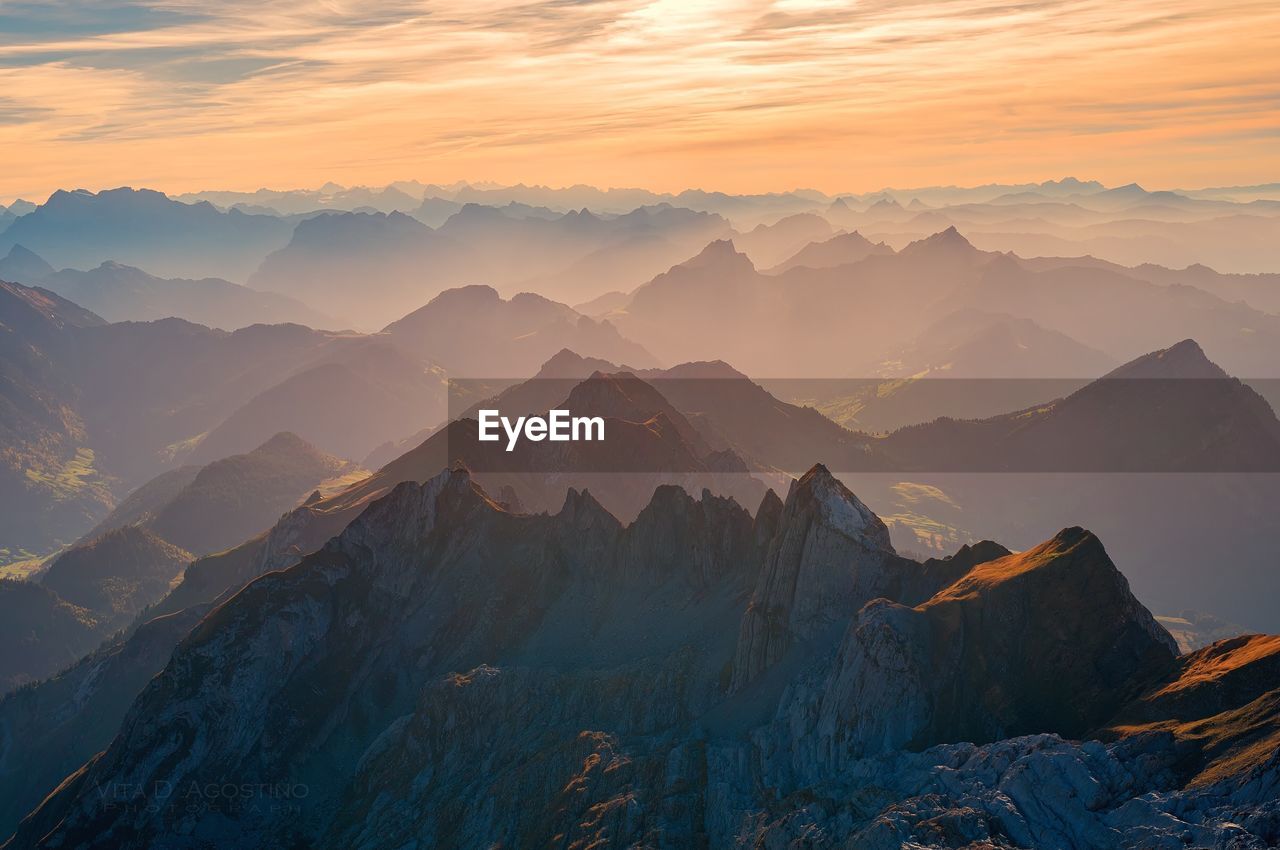 Scenic view of mountains against sky during sunset