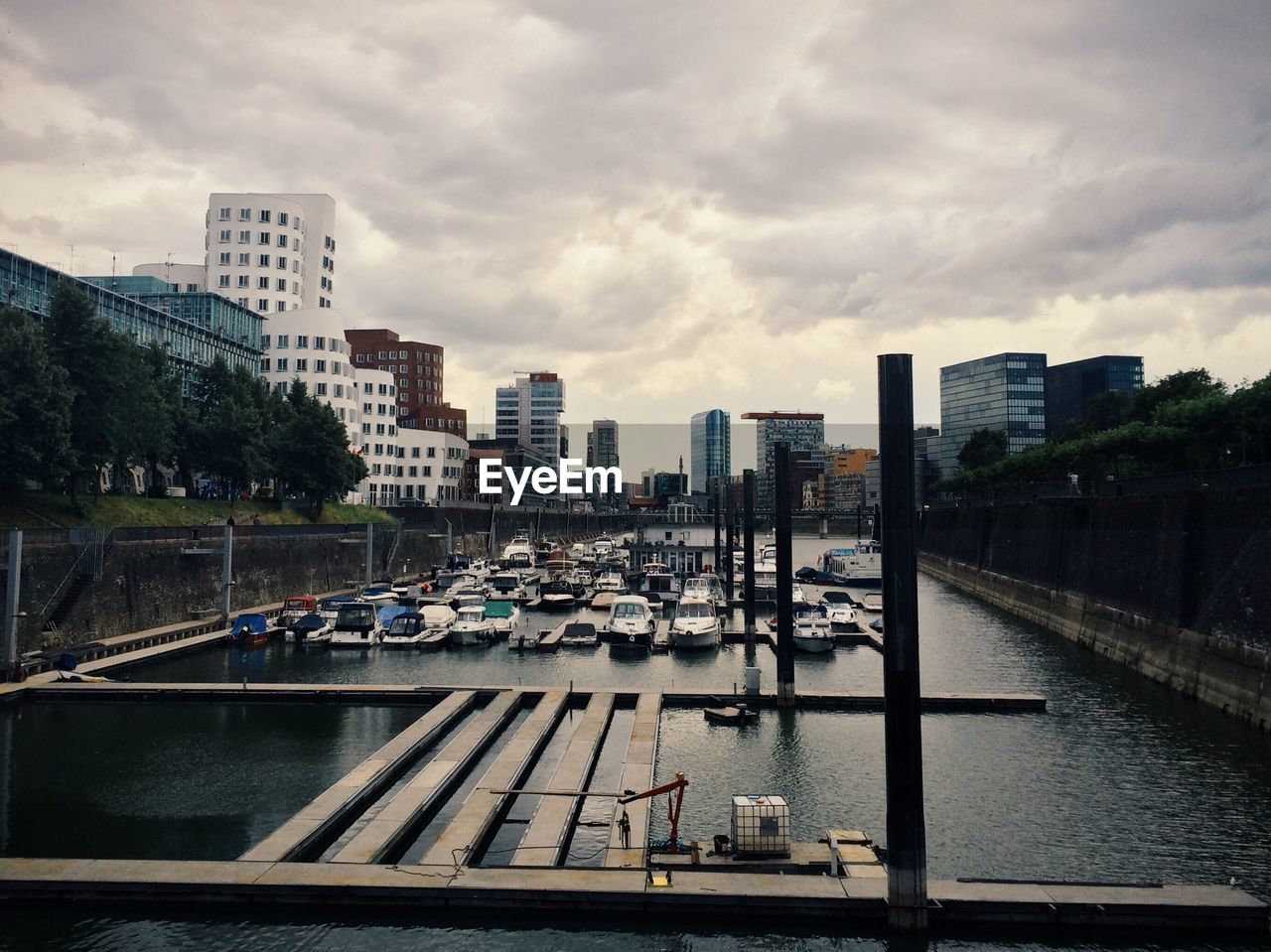 CITYSCAPE AGAINST CLOUDY SKY