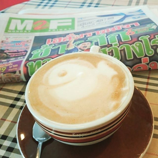 CLOSE-UP OF COFFEE CUP ON TABLE