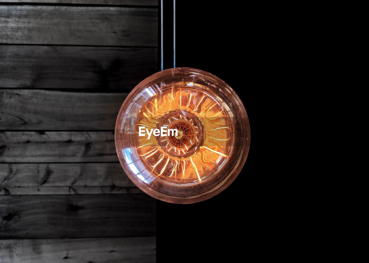 Close-up of illuminated light bulb