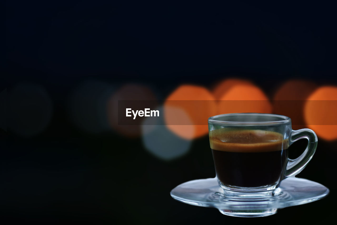 drink, refreshment, food and drink, mug, cup, coffee, coffee cup, copy space, hot drink, black background, crockery, freshness, still life, indoors, glass, no people, drinking glass, saucer, close-up, focus on foreground, studio shot, table, dark, household equipment, heat, food, cafe, frothy drink