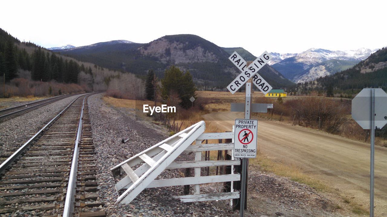 Railroad track leading towards mountains