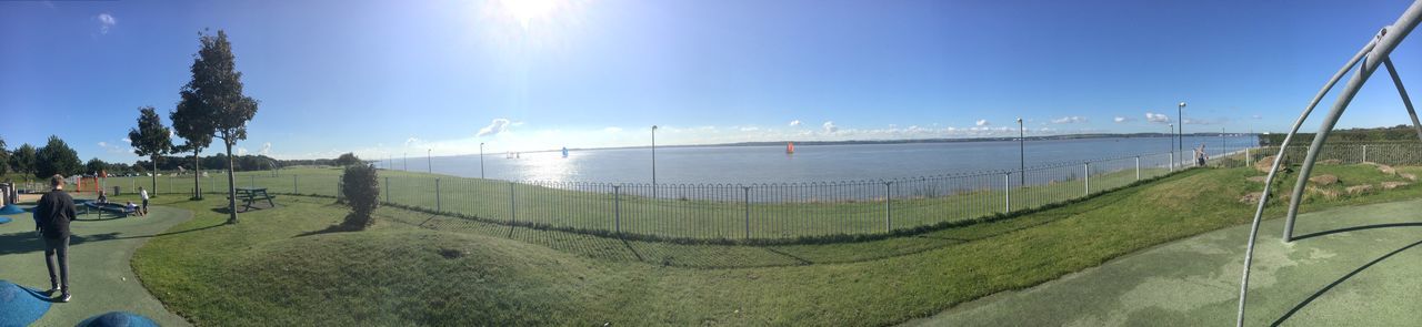 PANORAMIC SHOT OF CALM BLUE SEA AGAINST SKY