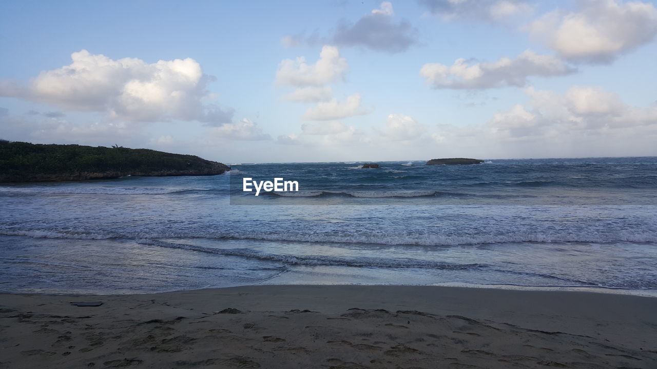 View of calm beach against the sky