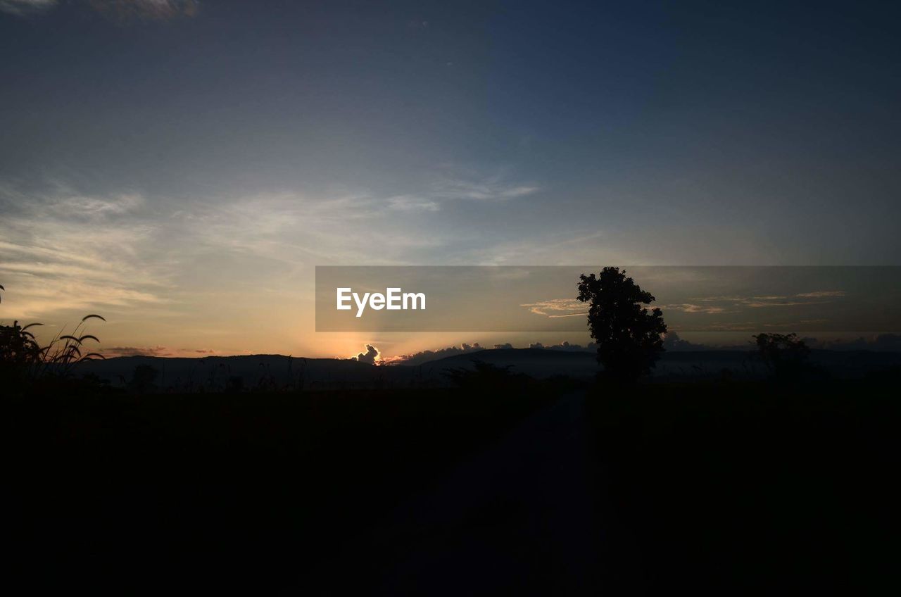 SILHOUETTE LANDSCAPE AGAINST SKY DURING SUNSET