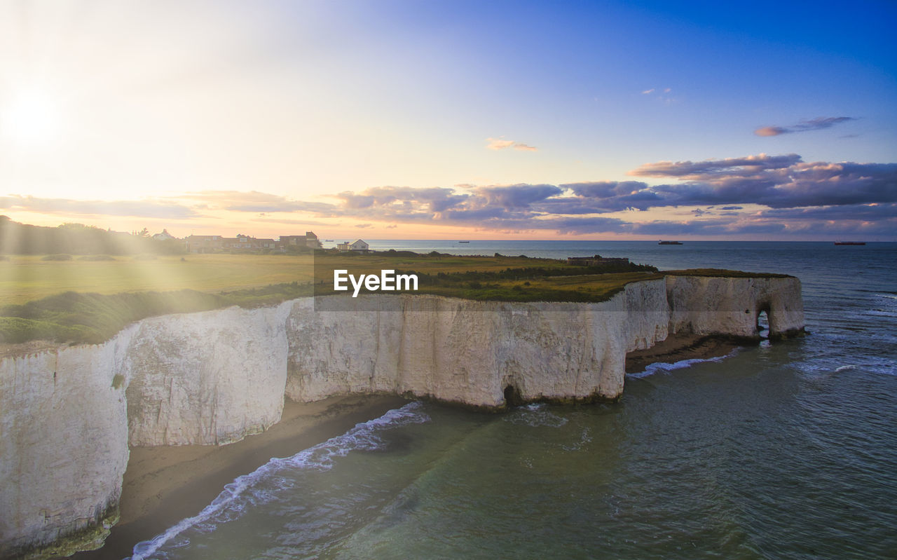 Scenic view of sea against sky during sunset