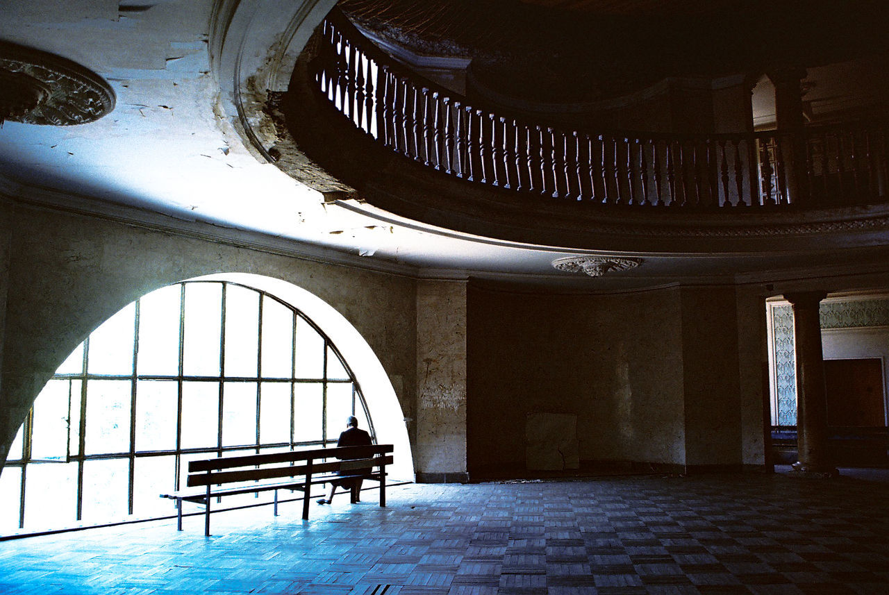 REAR VIEW OF PEOPLE ON CEILING IN BUILDING