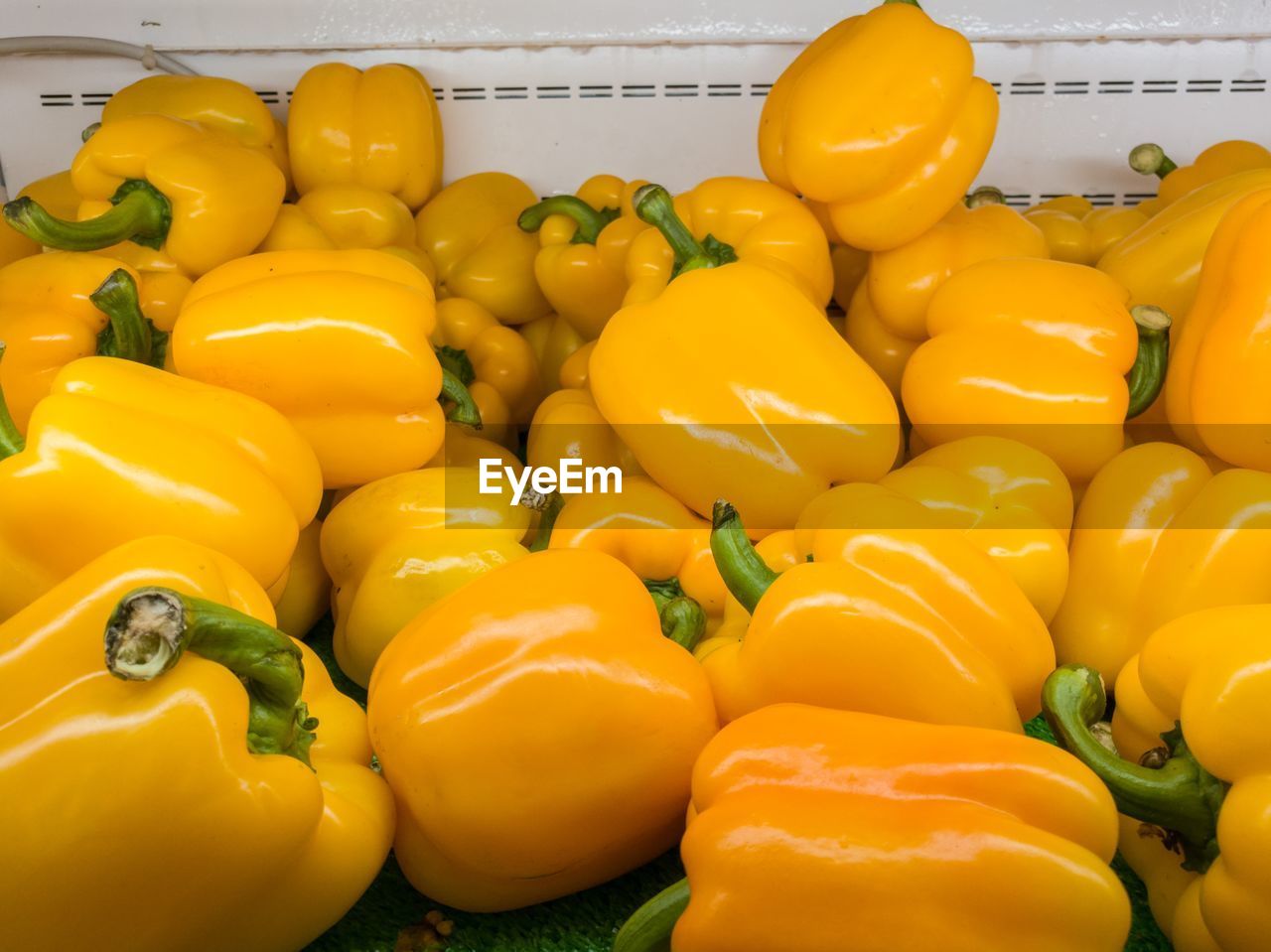Close-up of yellow bell peppers for sale in market