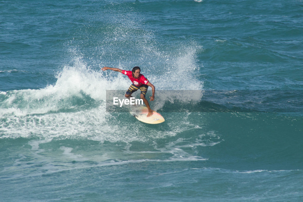 MAN JUMPING IN SEA