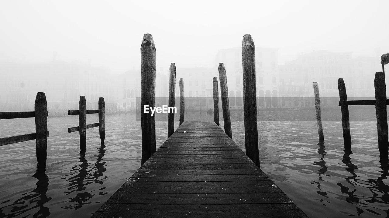 WOODEN POSTS IN SEA