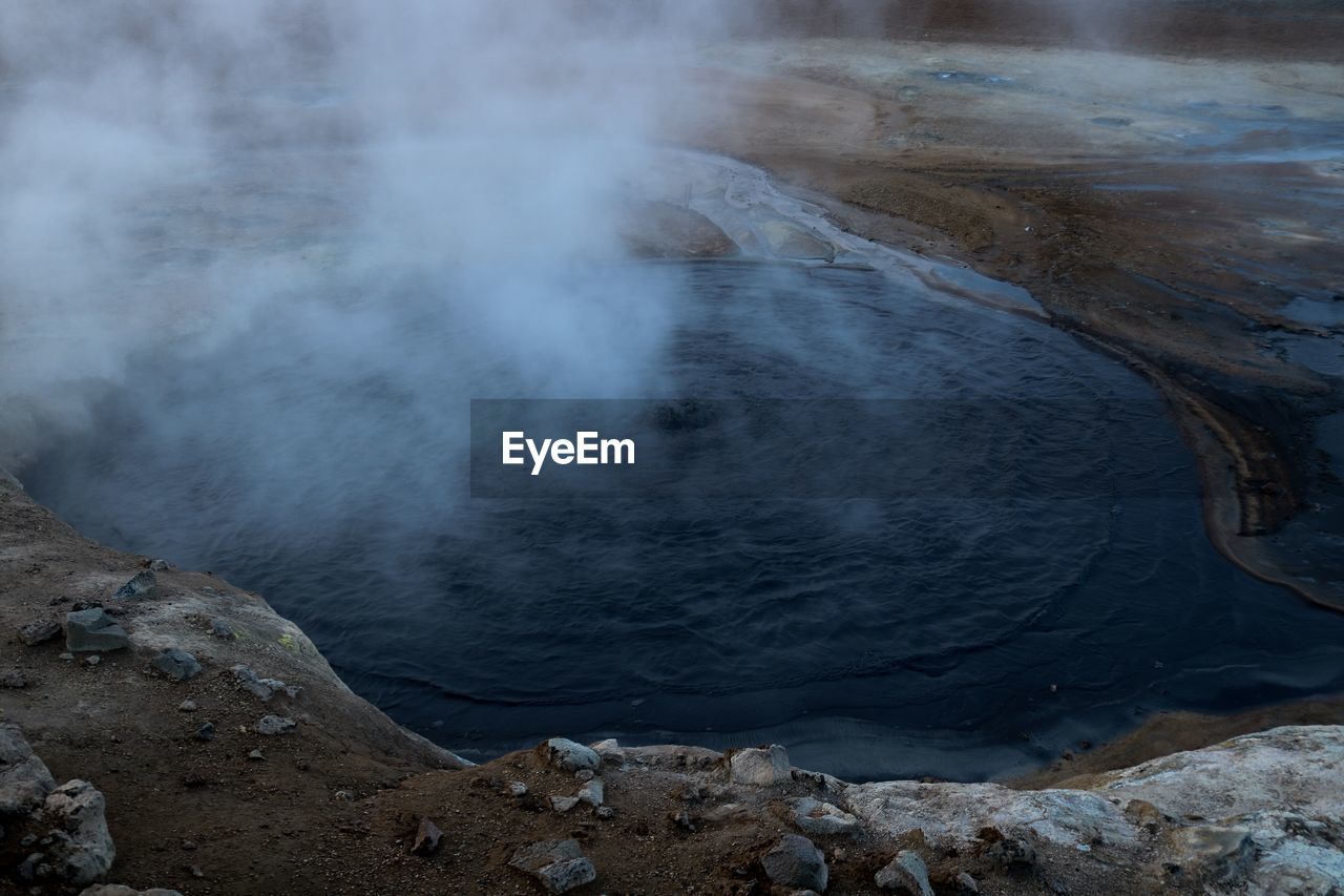 Smoke emitting from hot spring 