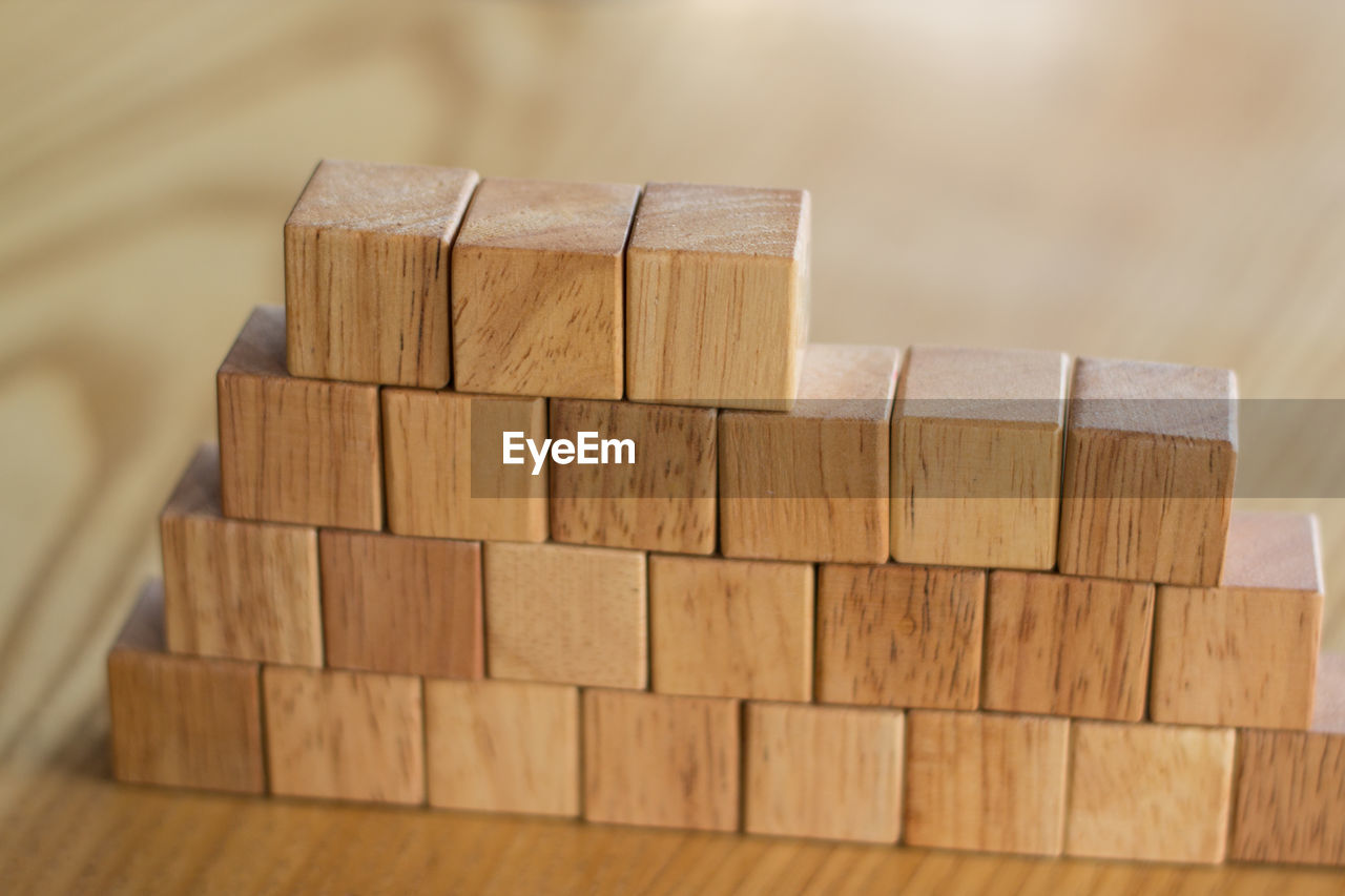 CLOSE-UP OF TOY ON WOODEN TABLE