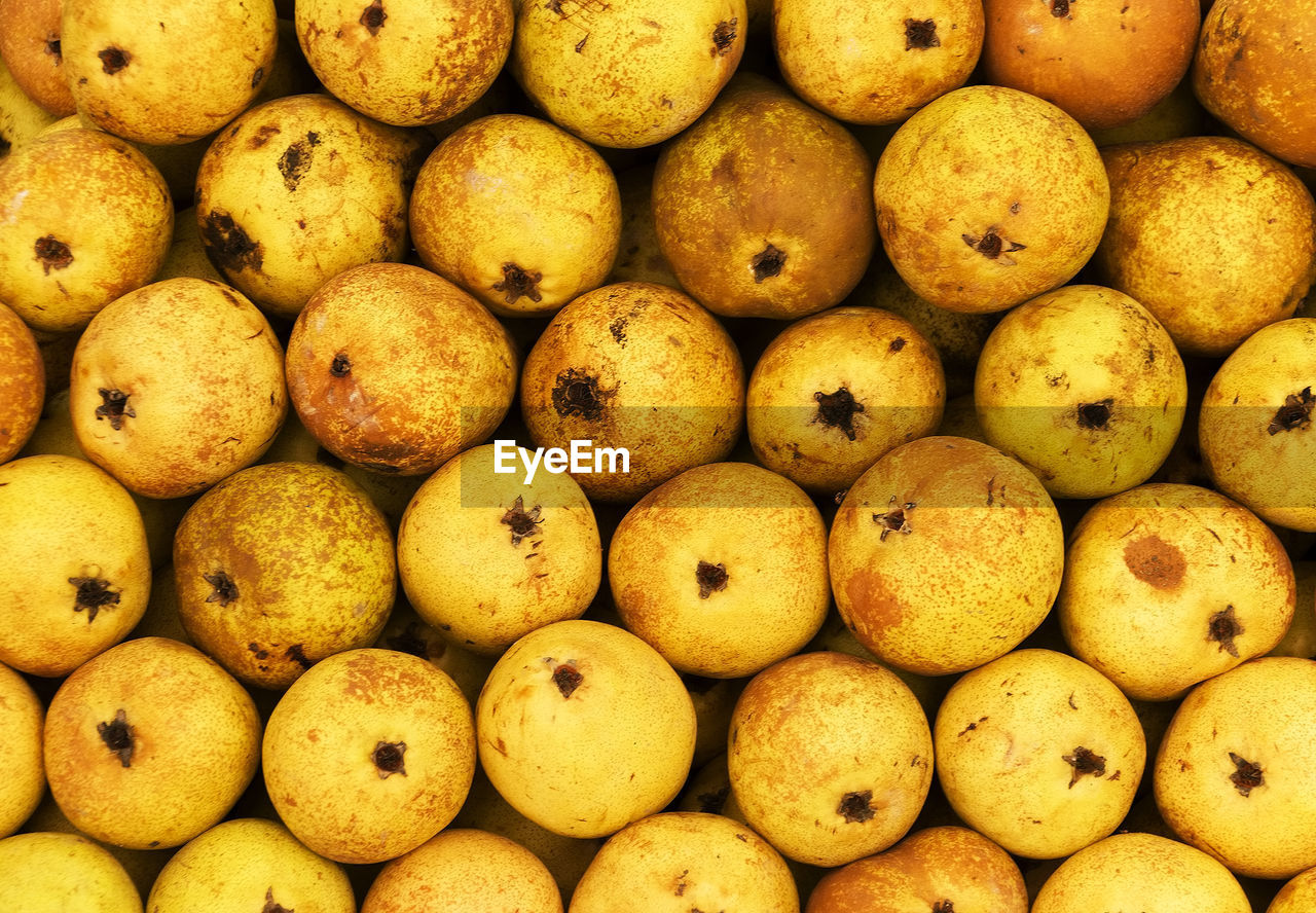 Full frame shot of quinces for sale at market