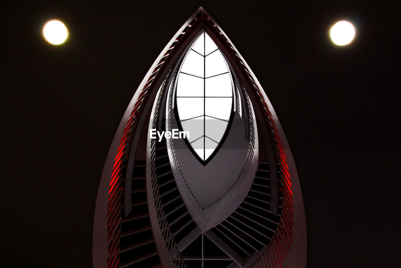 Low angle view of spiral staircase in building