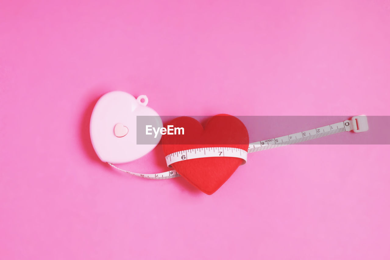 CLOSE-UP OF HEART SHAPE MADE FROM PINK FLOWER