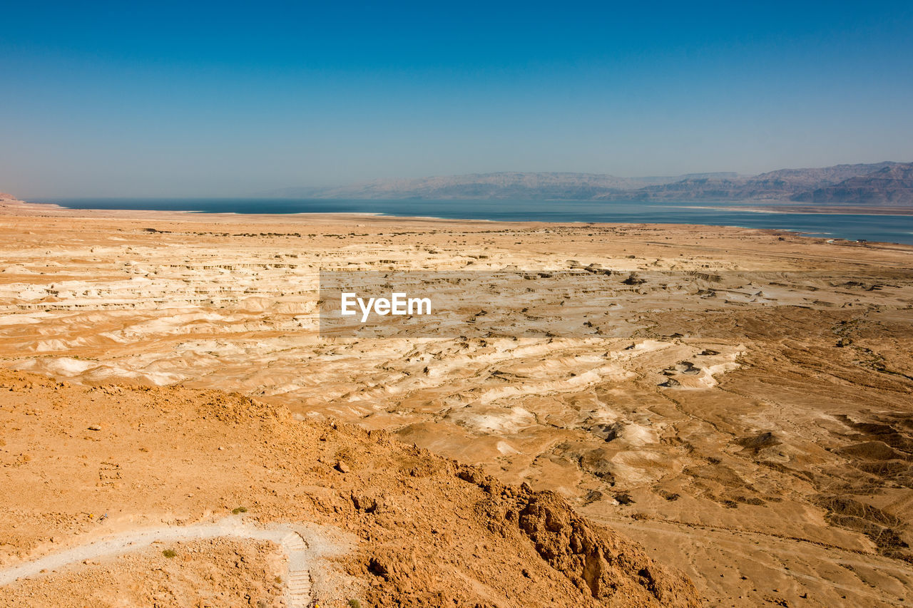 Scenic view of barren land near dead sea