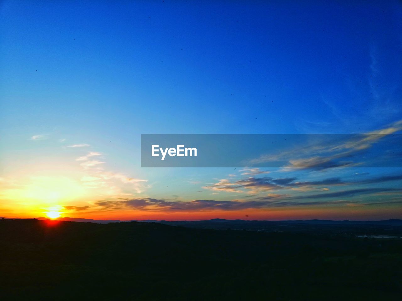 SCENIC VIEW OF SILHOUETTE LANDSCAPE AGAINST ROMANTIC SKY