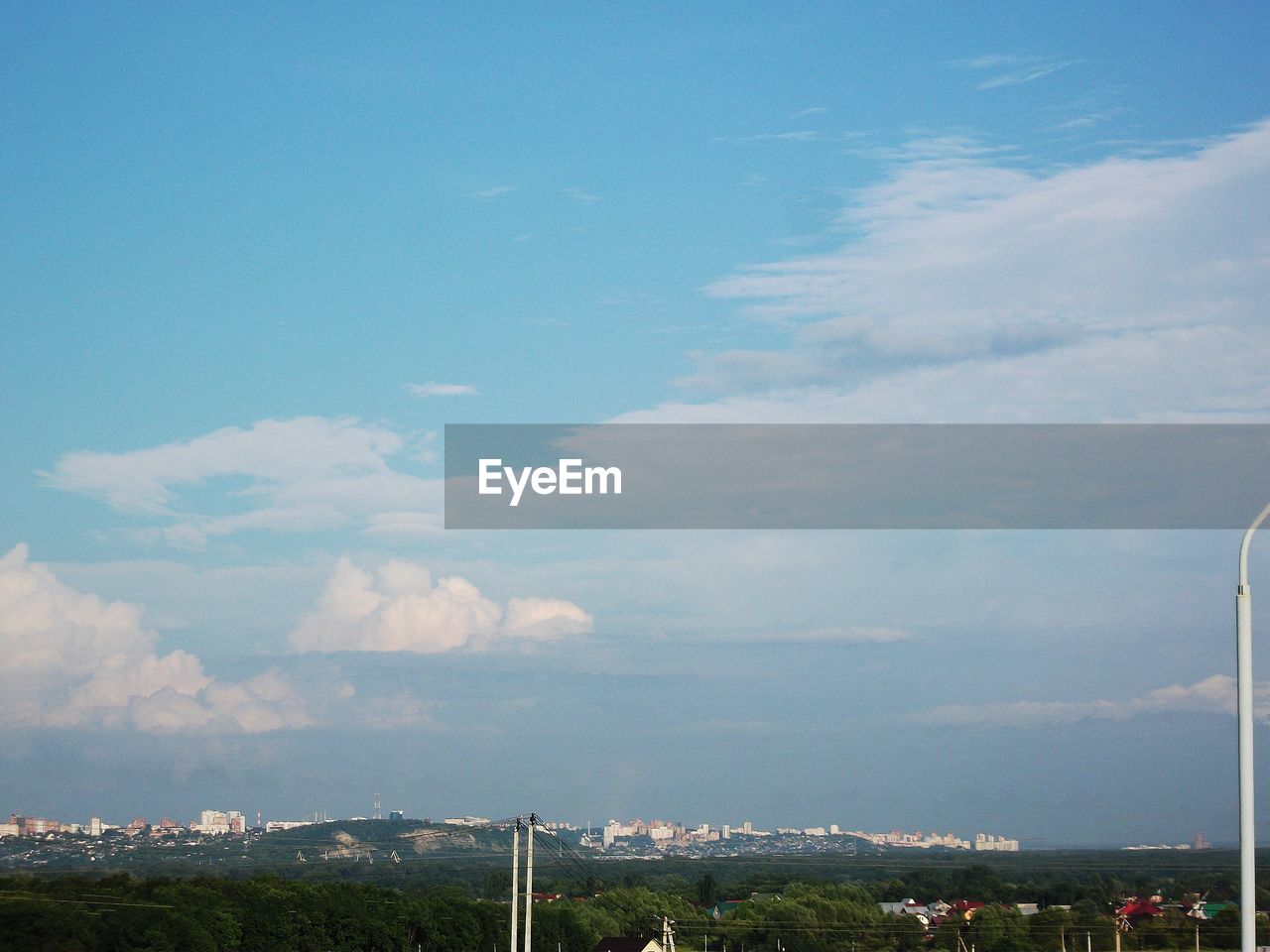 Aerial view of city and buildings against sky