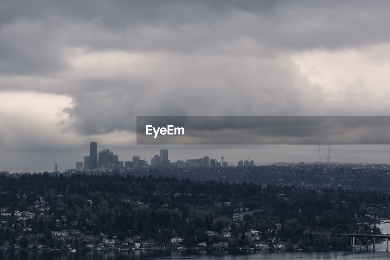 Panoramic view of buildings in city against sky