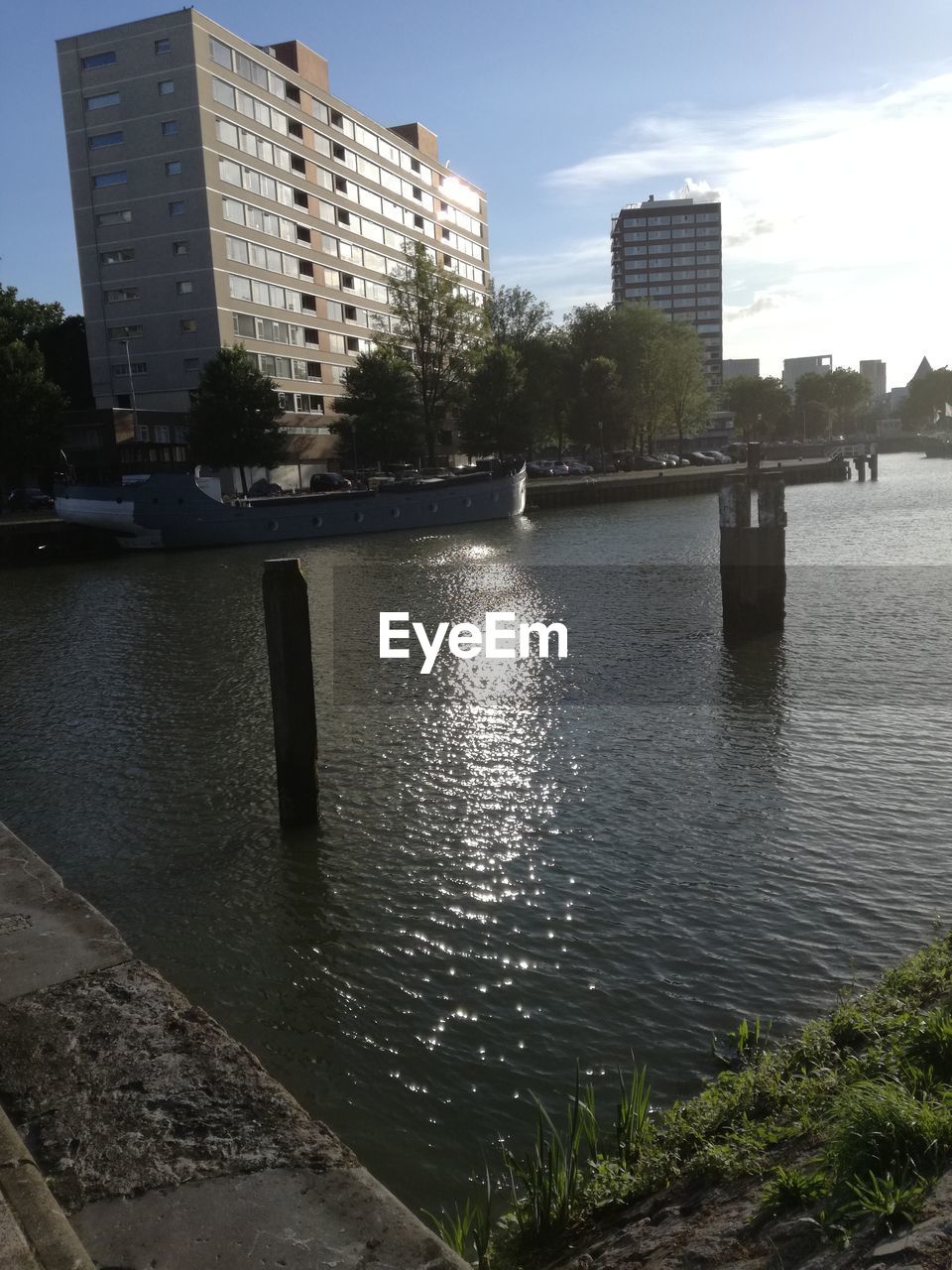 RIVER WITH BUILDINGS IN BACKGROUND