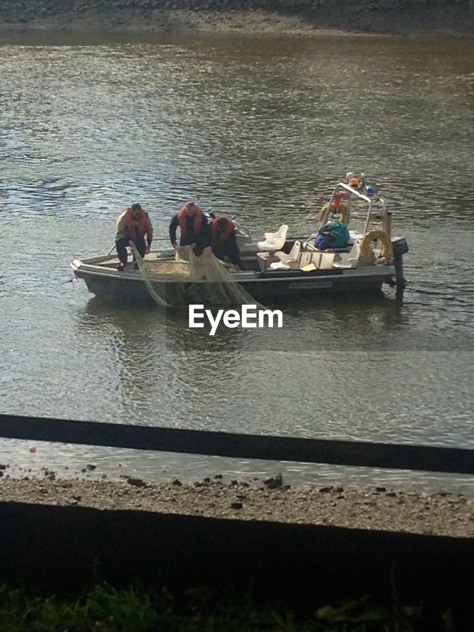 PEOPLE ON BOAT IN SEA