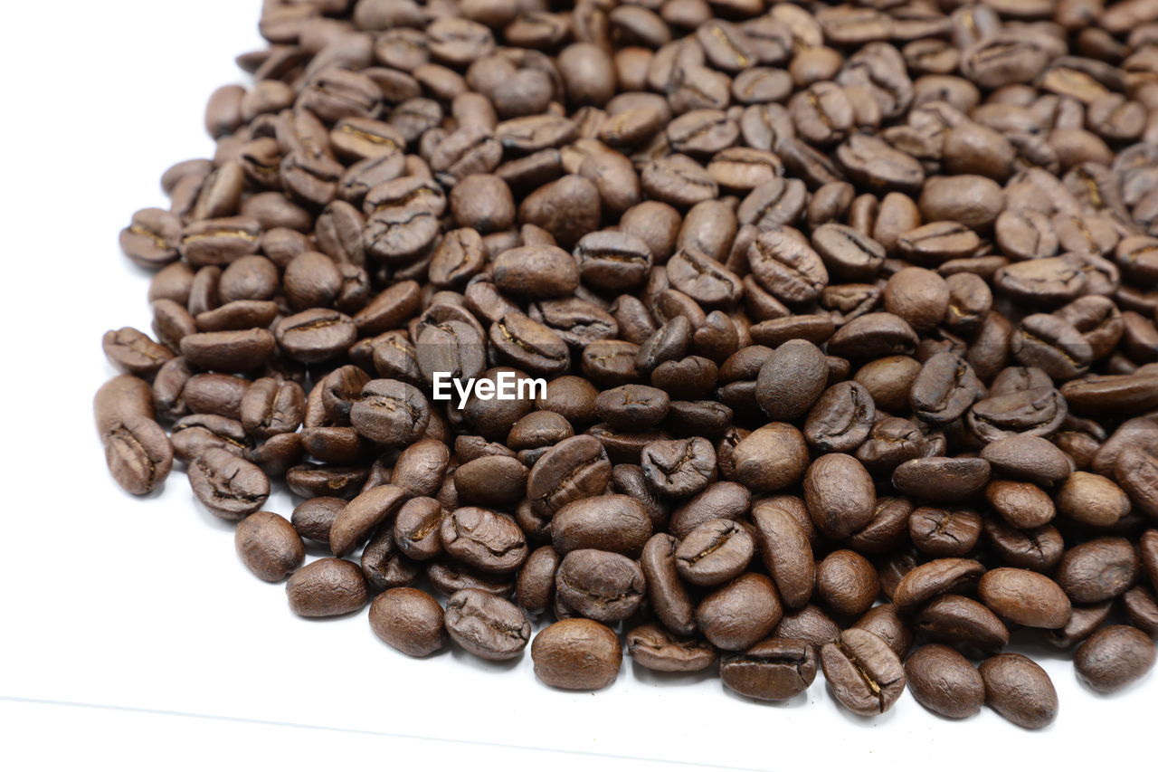 HIGH ANGLE VIEW OF COFFEE BEANS IN BACKGROUND