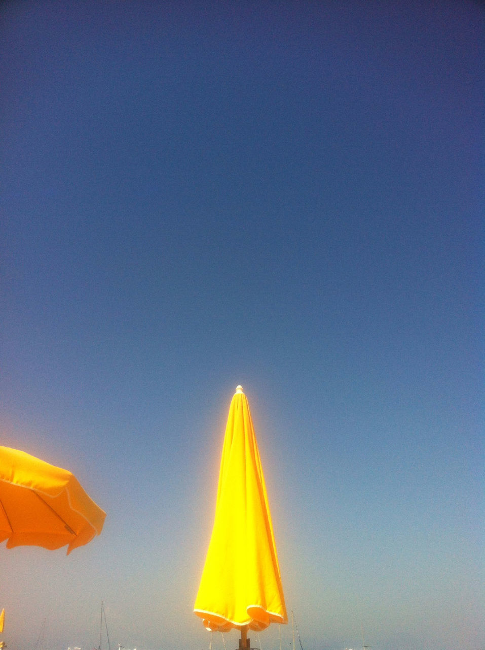 Yellow sunshades against the blue sky