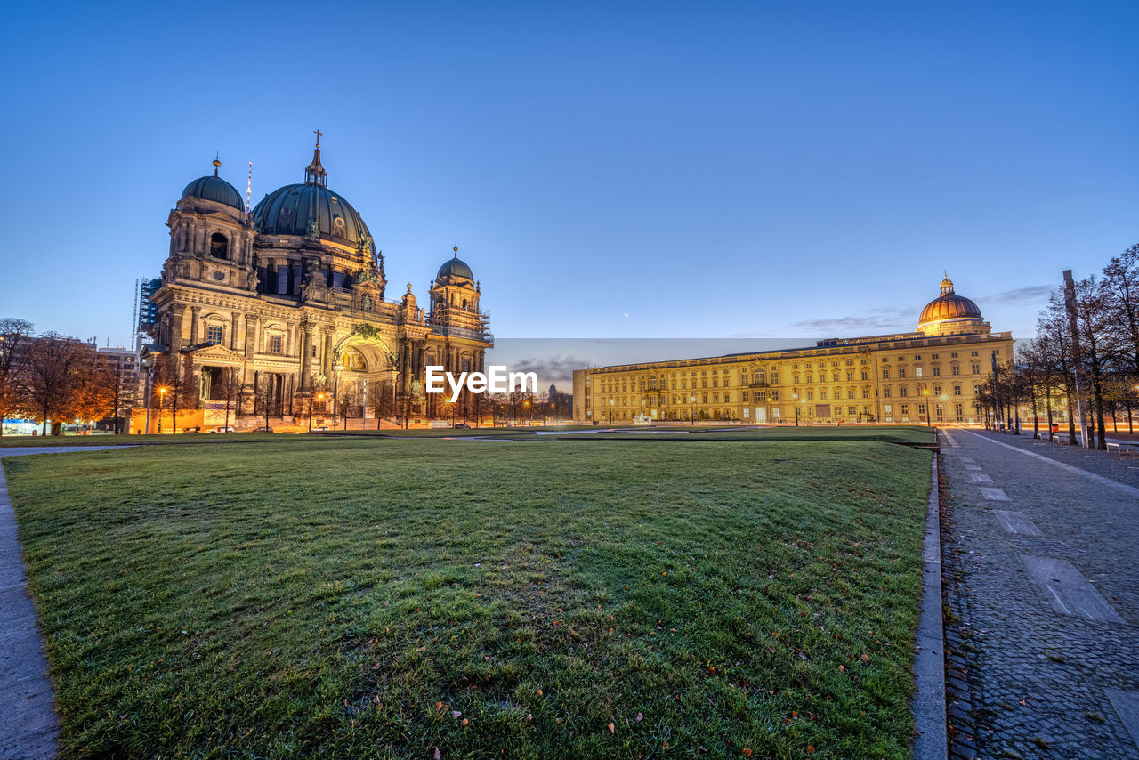 The lustgarten in berlin before sunrise with the cathedral and the city palace