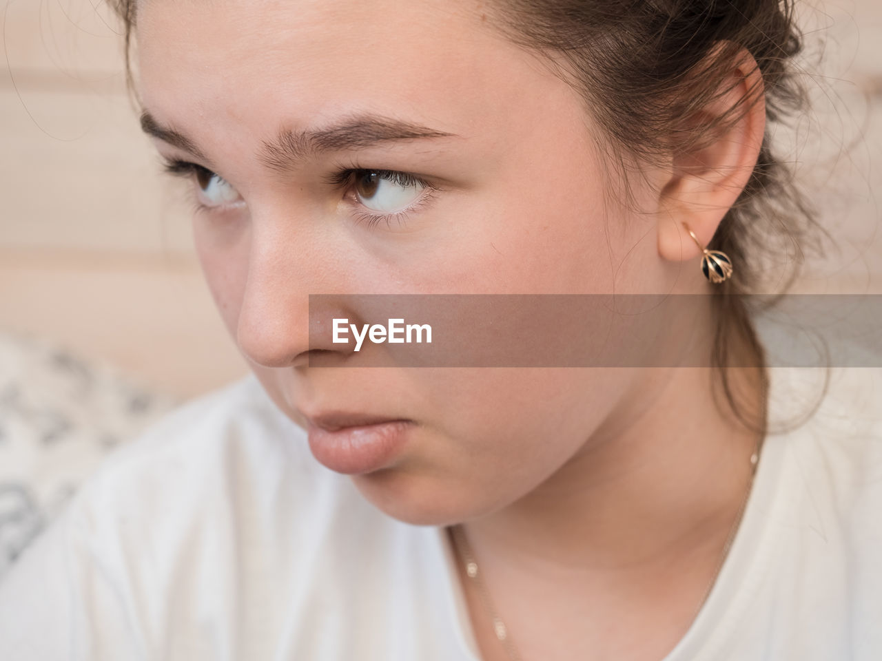 Close-up of thoughtful girl looking away