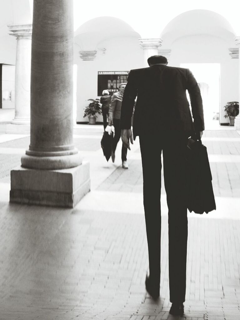 WOMAN WALKING IN SHOPPING MALL