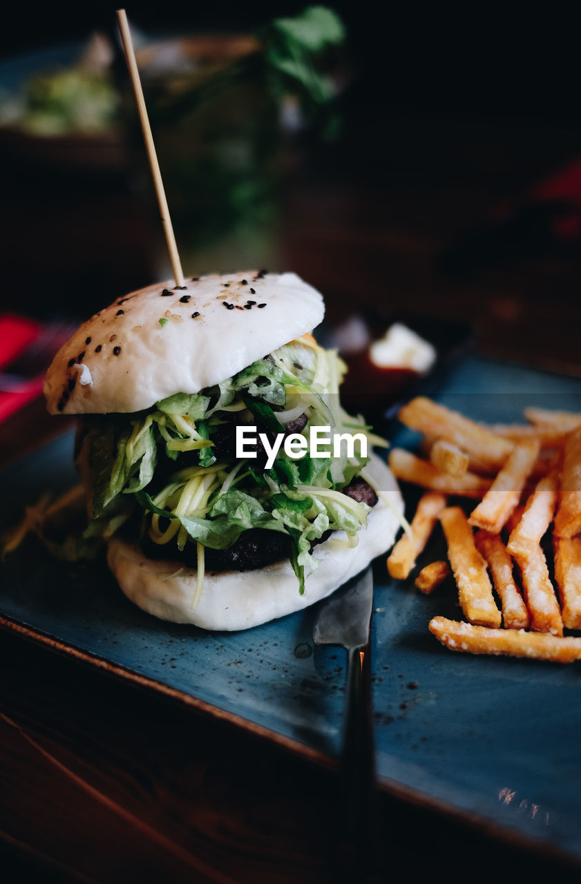 Close-up of burger in serving tray on table