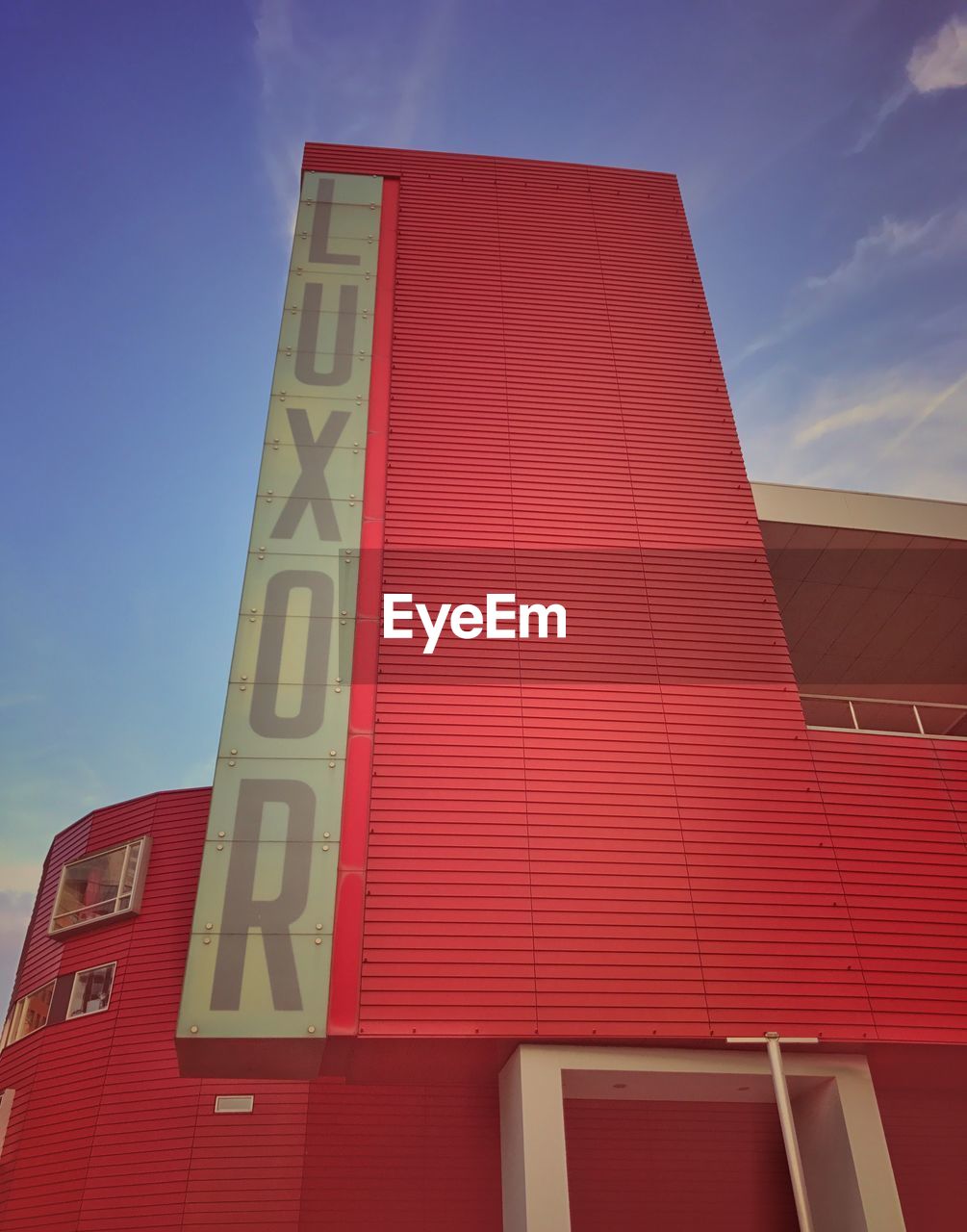 LOW ANGLE VIEW OF RED BUILDING AGAINST SKY