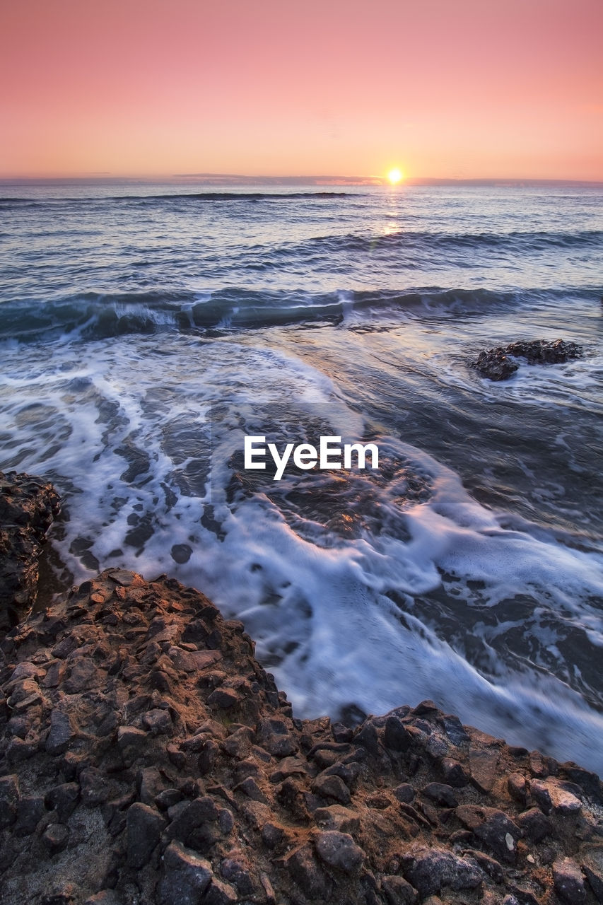 Scenic view of sea against sky during sunset