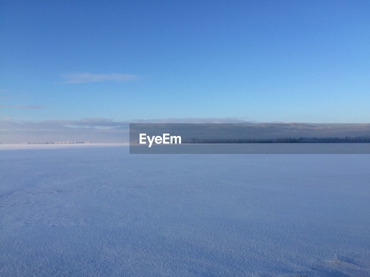 SCENIC VIEW OF LANDSCAPE AGAINST BLUE SKY DURING WINTER