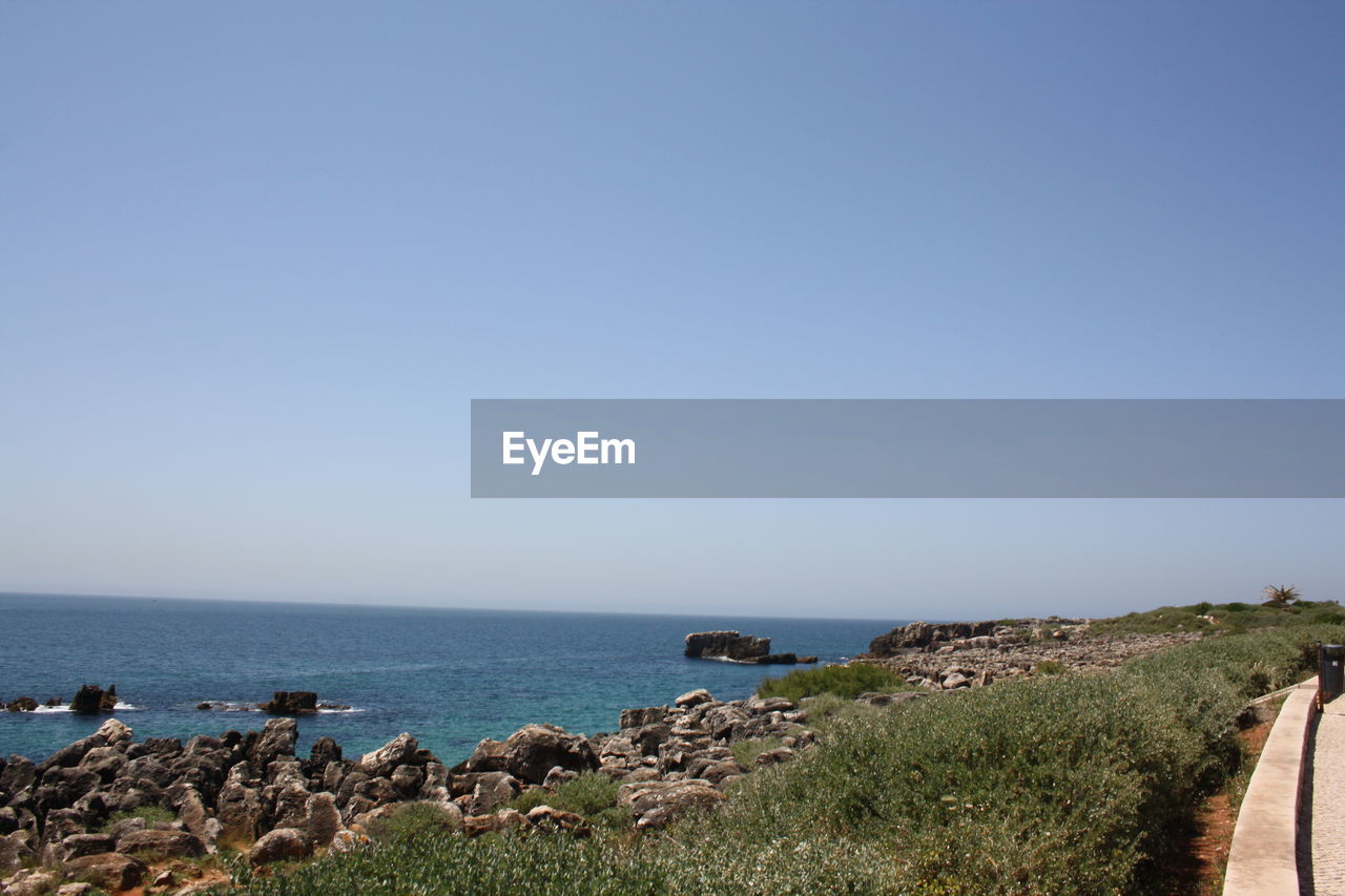 Scenic view of sea against clear sky