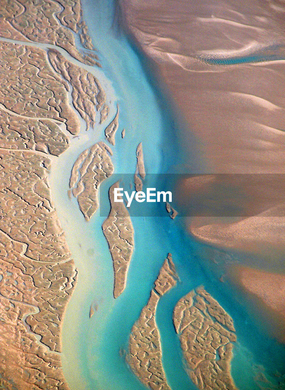 Aerial high angle view of water features and sand in the kimberley region of western australia