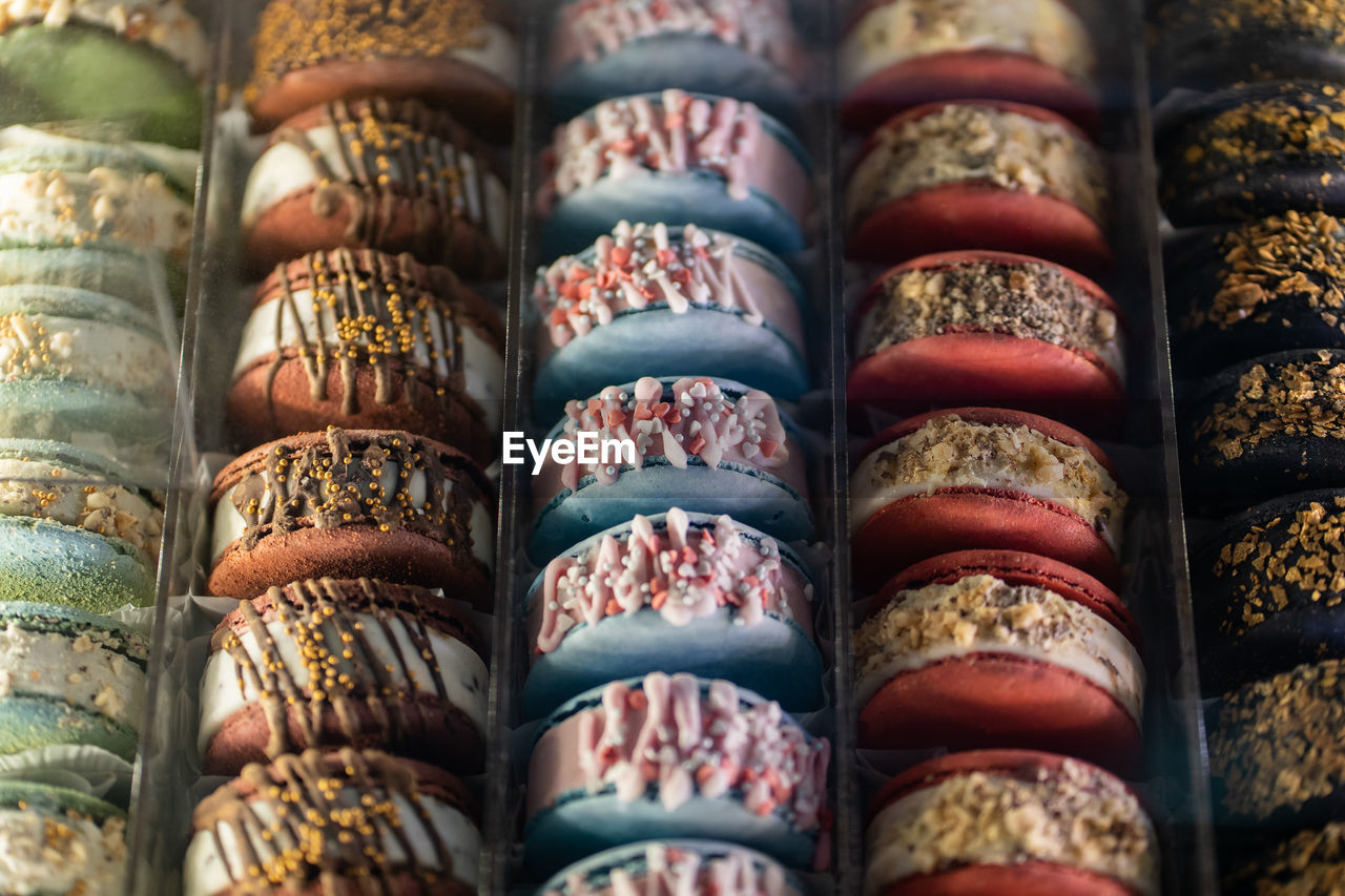 Closeup of colorful french macaron in showcase. top view.