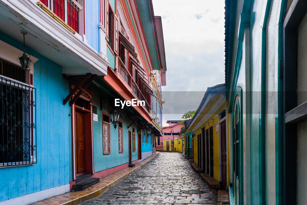 Multi colored houses against sky