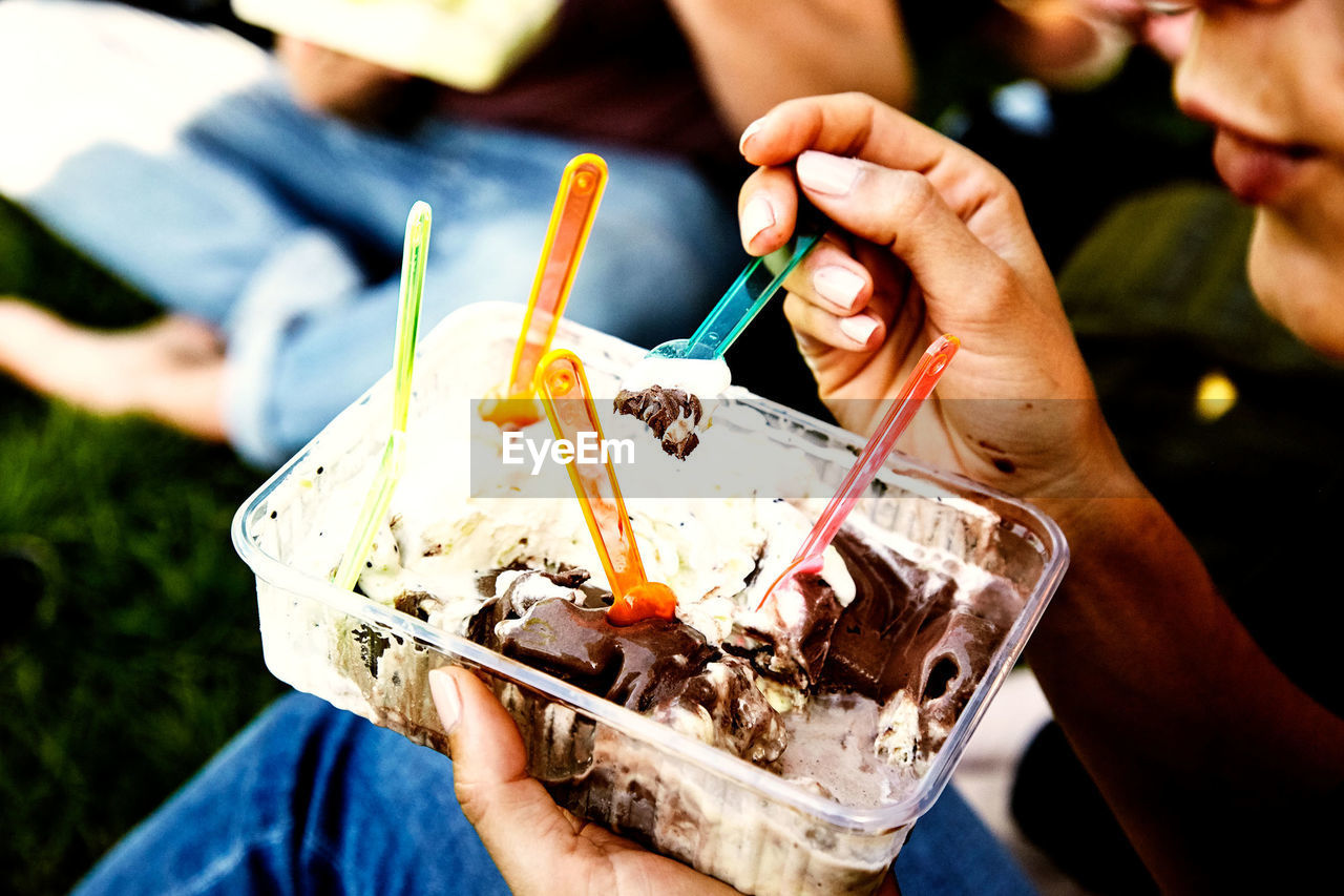 Close-up of hand holding ice cream