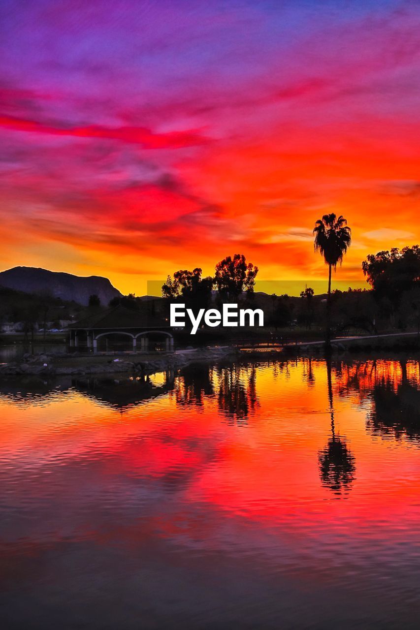 SCENIC VIEW OF LAKE AGAINST ROMANTIC SKY