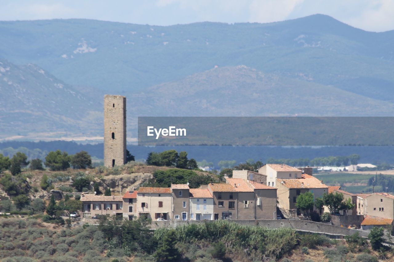 VIEW OF HOUSE AND MOUNTAIN RANGE