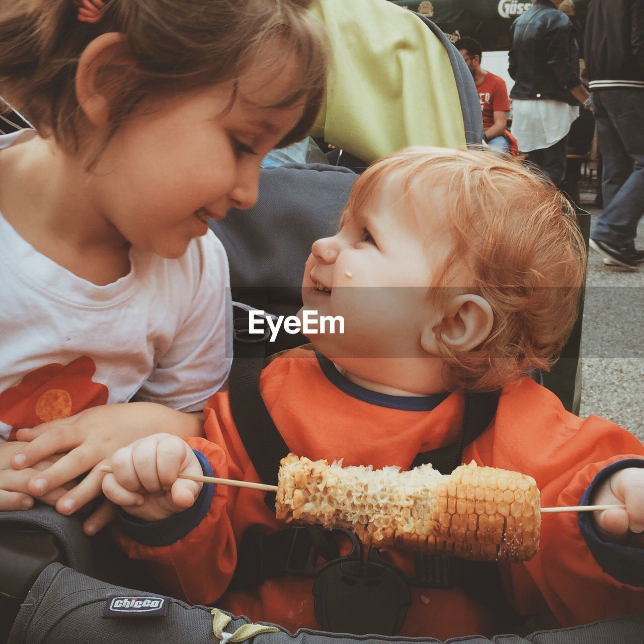 CLOSE-UP OF BOY EATING WHILE SITTING