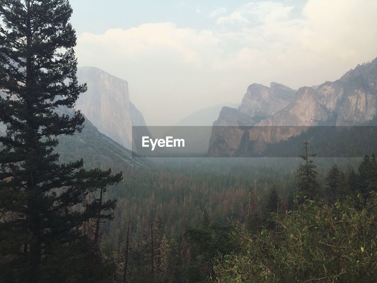 Scenic view of mountains in foggy weather